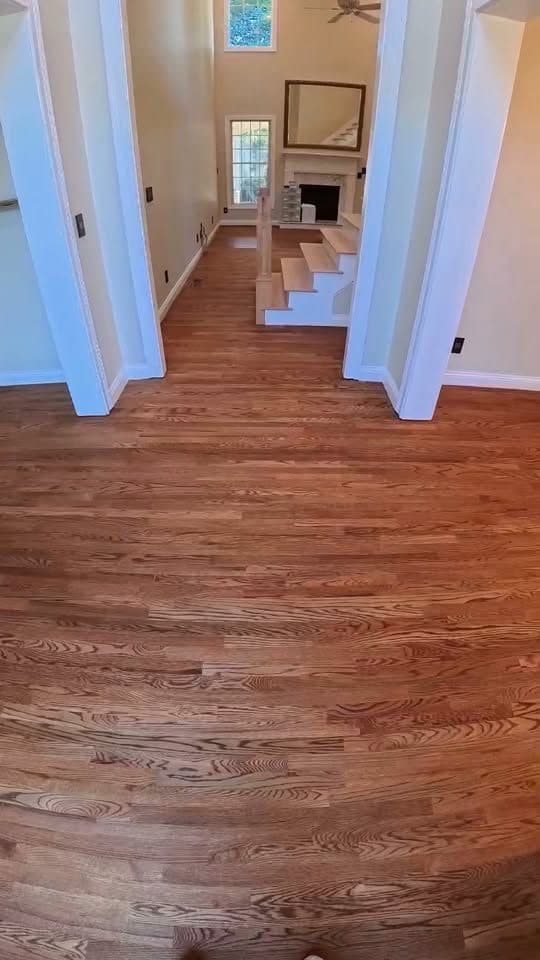 Red oak hardwood floor and stair treads with white risers after a Bona Chroma® finish — Athens, AL job by Alabama Hardwood Restoration